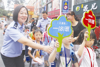 Police escort primary school students in Nanyang
